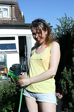 Hairy Mature Lady Playing With The Hose In The Garden