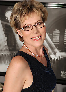 Elegant 57 Year Old Georgina C Uses Her Glasses To Toy Her Pussy