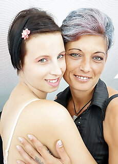 Old And Young Lesbian Couple Make Out On The Couch